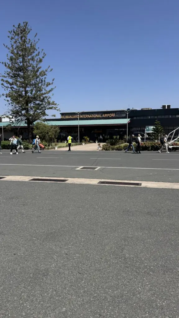 Kilimanjaro International Airport exterior with people arriving