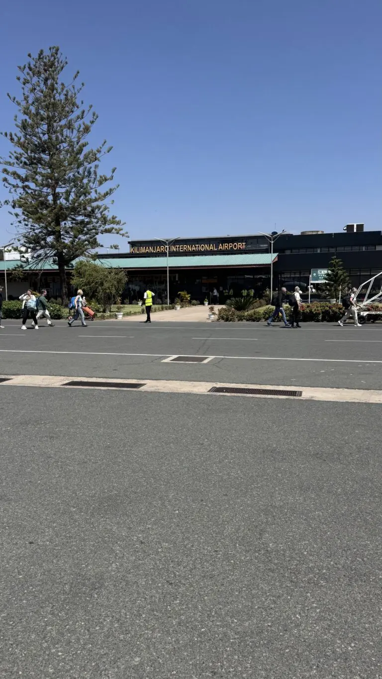 Kilimanjaro International Airport exterior with people arriving