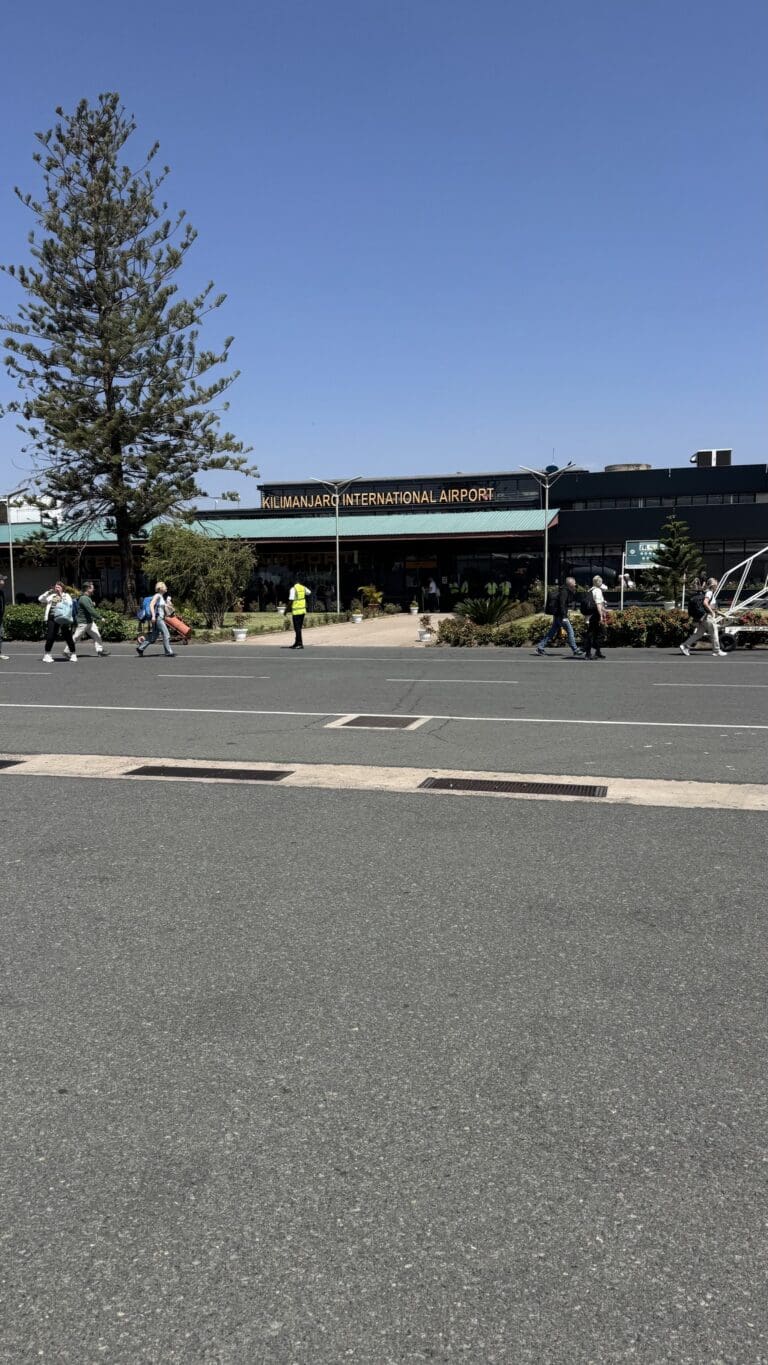 Kilimanjaro International Airport exterior with people arriving