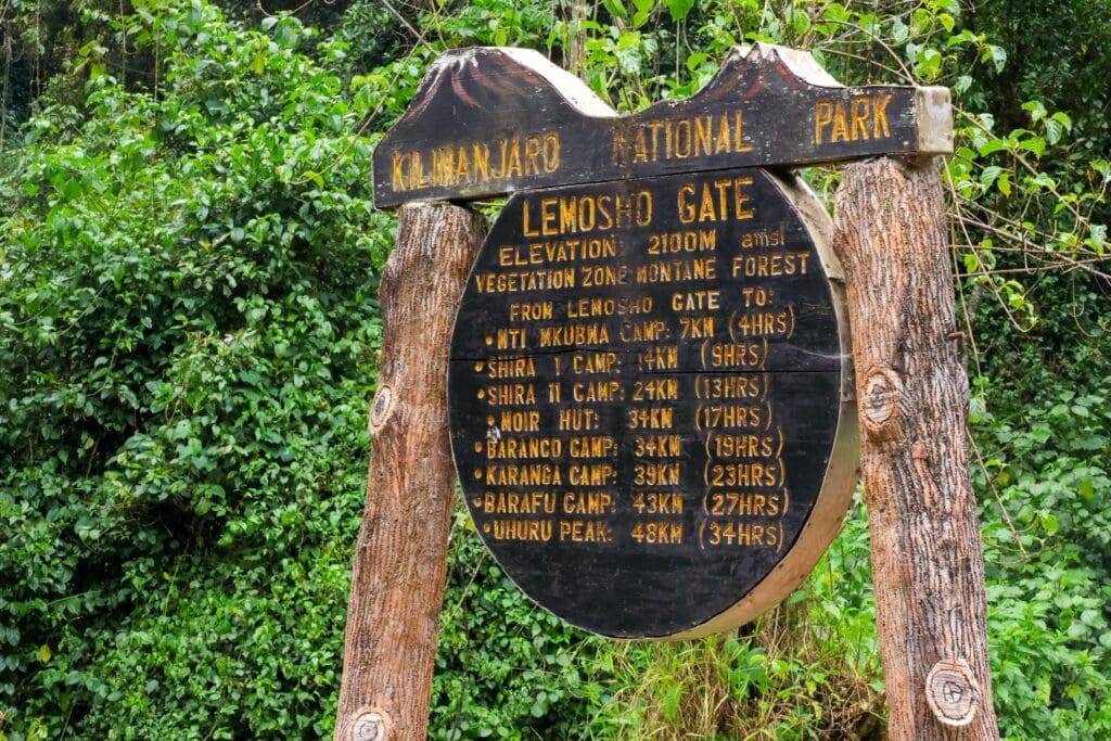 Kilimanjaro National Park Lemosho Gate sign with hiking distances