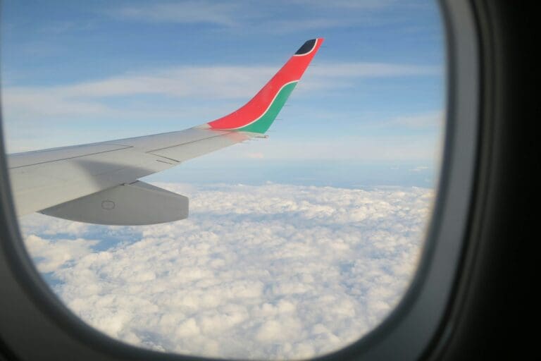 airplane wing over clouds from window view